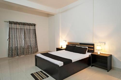 Imagen de la habitación del Hotel OYO Shriya\'s Nirvana Inn. Foto 19