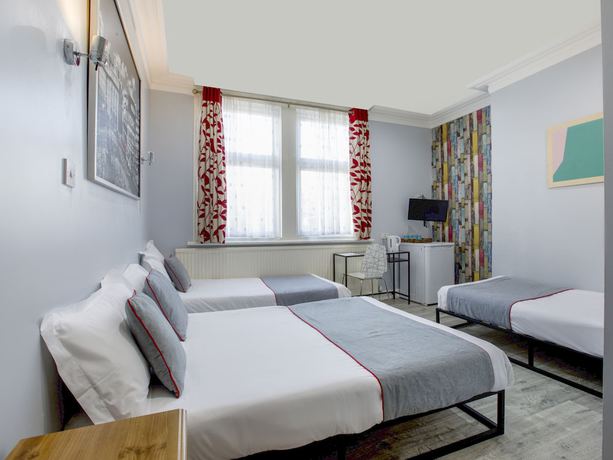 Imagen de la habitación del Hotel OYO Sino. Foto 12