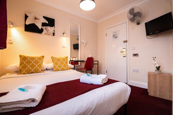 Imagen de la habitación del Hotel OYO Sino. Foto 19