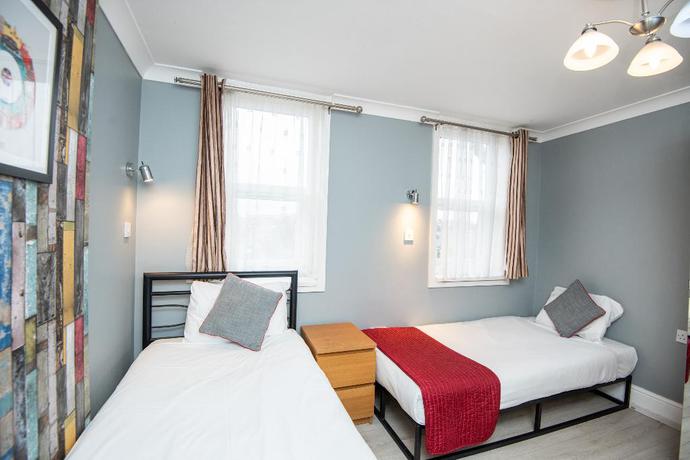 Imagen de la habitación del Hotel OYO Sino. Foto 5