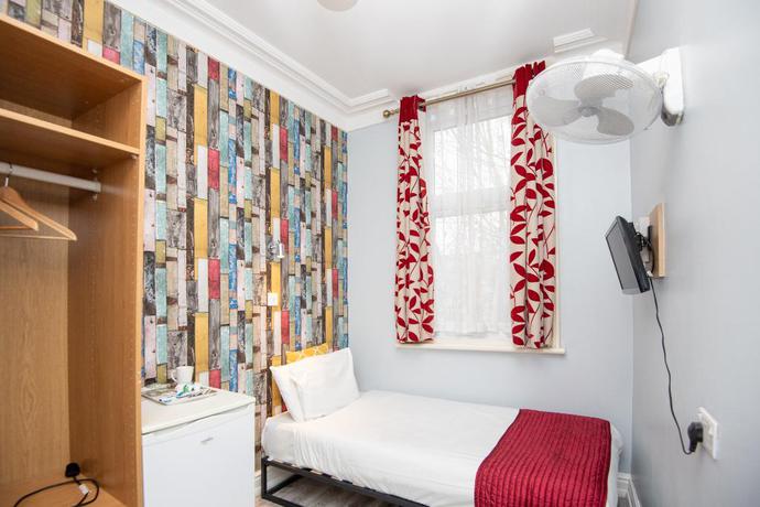 Imagen de la habitación del Hotel OYO Sino. Foto 12