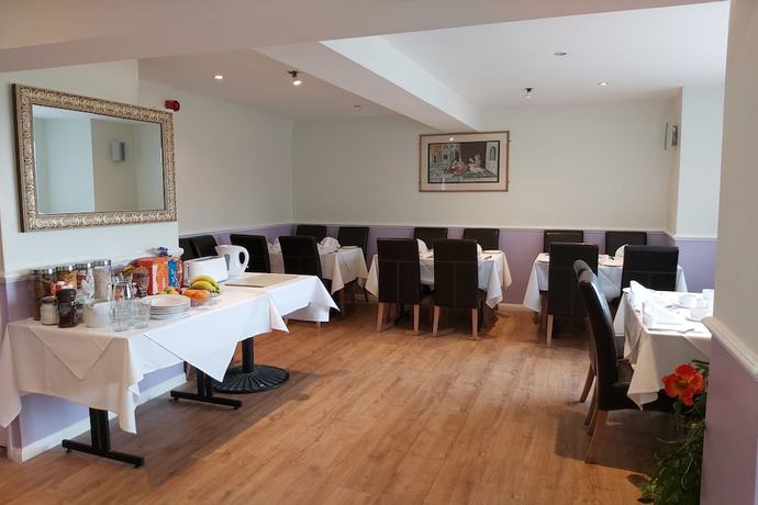 Imagen del bar/restaurante del Hotel OYO Slap Up Lodge, Leyland Waters Cambridge. Foto 4