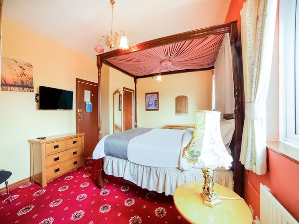 Imagen de la habitación del Hotel OYO The Royal. Foto 13
