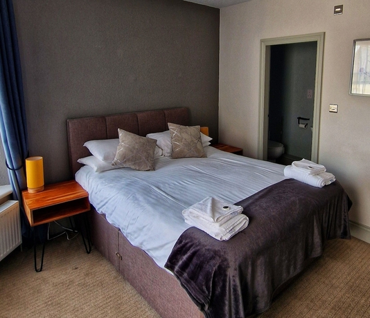Imagen de la habitación del Hotel OYO The Victorian Cap. Foto 7