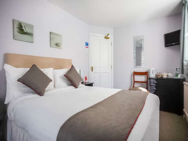 Imagen de la habitación del Hotel OYO Timothy's. Foto 11