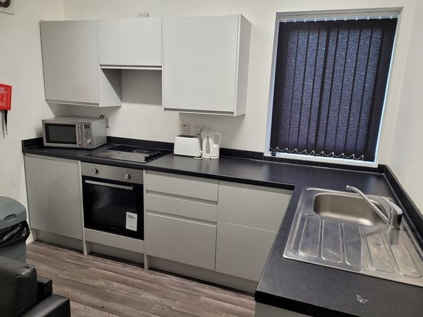 Imagen de la habitación del Hotel OYO Victoria Apartments. Foto 7