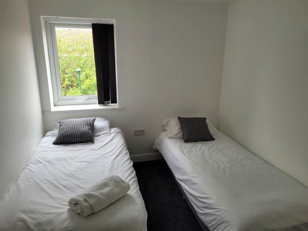 Imagen de la habitación del Hotel OYO Victoria Apartments. Foto 14