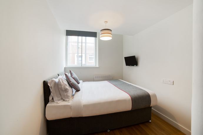 Imagen de la habitación del Hotel OYO Vincent Apartments. Foto 7