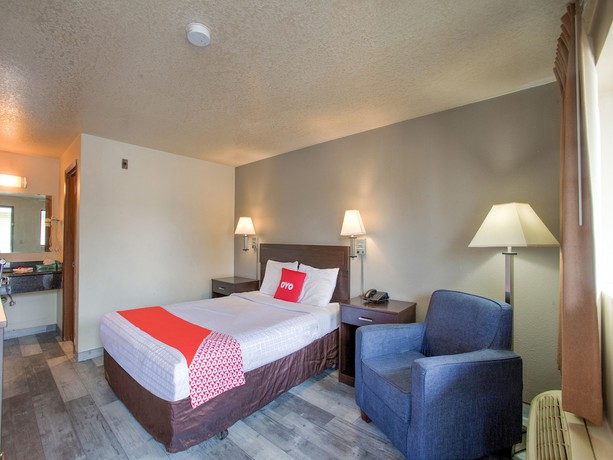 Imagen de la habitación del Hotel OYO Woodland and Suites. Foto 3