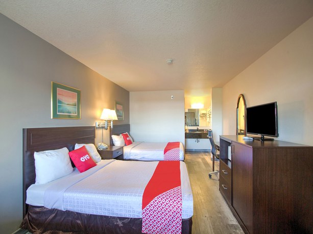 Imagen de la habitación del Hotel OYO Woodland and Suites. Foto 6
