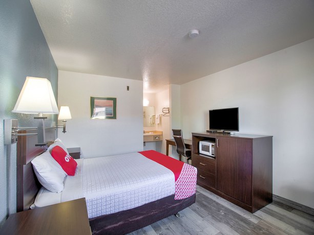 Imagen de la habitación del Hotel OYO Woodland and Suites. Foto 8