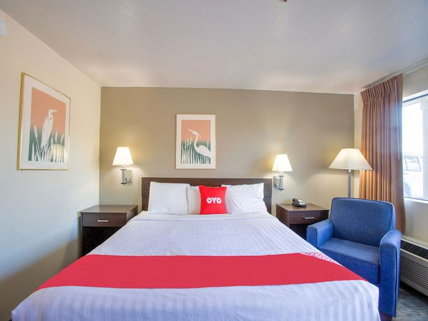Imagen de la habitación del Hotel OYO Woodland and Suites. Foto 9