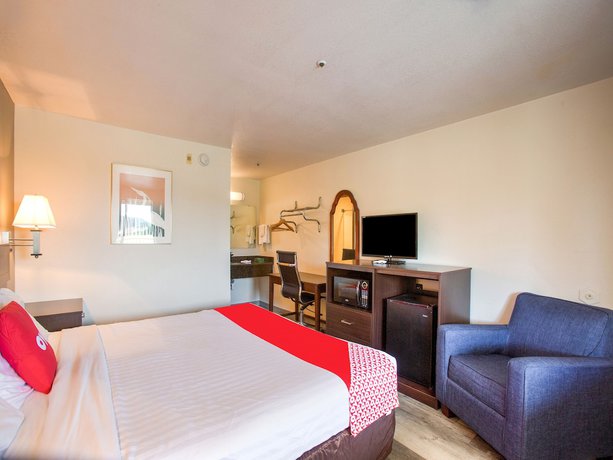 Imagen de la habitación del Hotel OYO Woodland and Suites. Foto 10