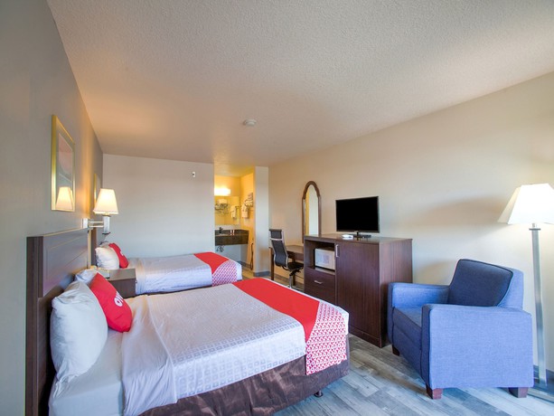 Imagen de la habitación del Hotel OYO Woodland and Suites. Foto 12