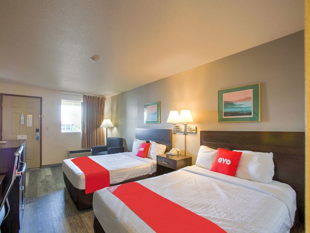 Imagen de la habitación del Hotel OYO Woodland and Suites. Foto 14