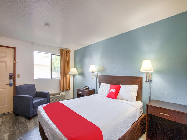 Imagen de la habitación del Hotel OYO Woodland and Suites. Foto 15