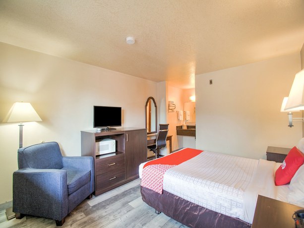 Imagen de la habitación del Hotel OYO Woodland and Suites. Foto 16