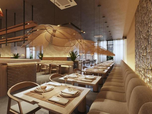 Imagen del bar/restaurante del Hotel OZ Collection. Foto 2