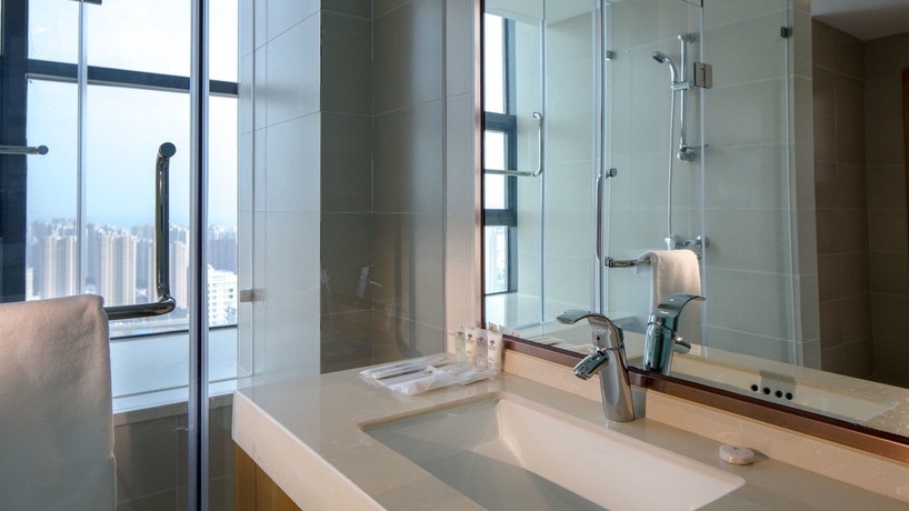 Imagen de la habitación del Hotel Oak Chateau Dalian. Foto 10