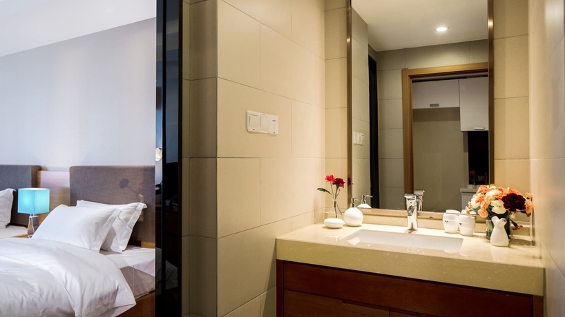 Imagen de la habitación del Hotel Oak Chateau Dalian. Foto 11
