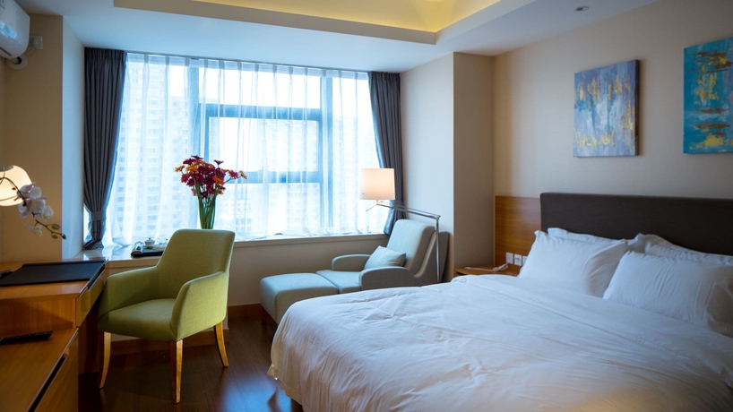 Imagen de la habitación del Hotel Oak Chateau Dalian. Foto 14