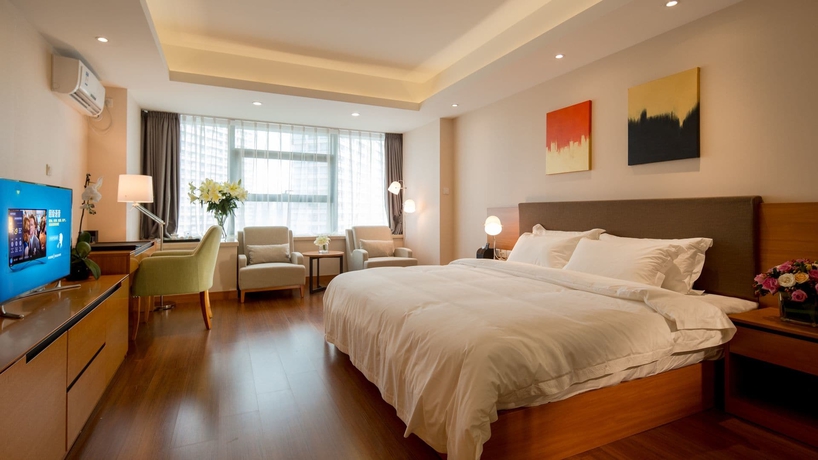 Imagen de la habitación del Hotel Oak Chateau Dalian. Foto 16
