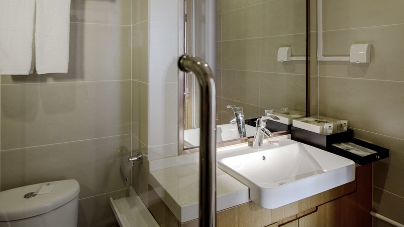 Imagen de la habitación del Hotel Oak Chateau Dalian. Foto 17