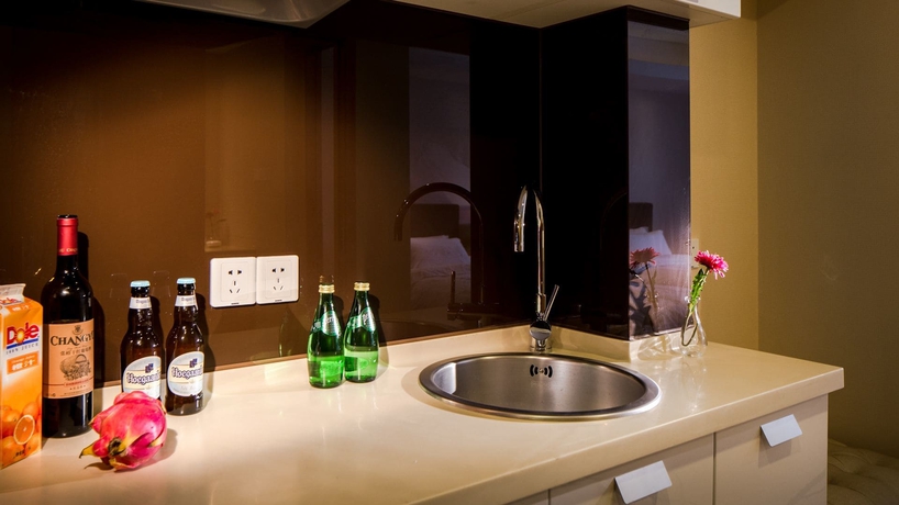 Imagen de la habitación del Hotel Oak Chateau Dalian. Foto 18