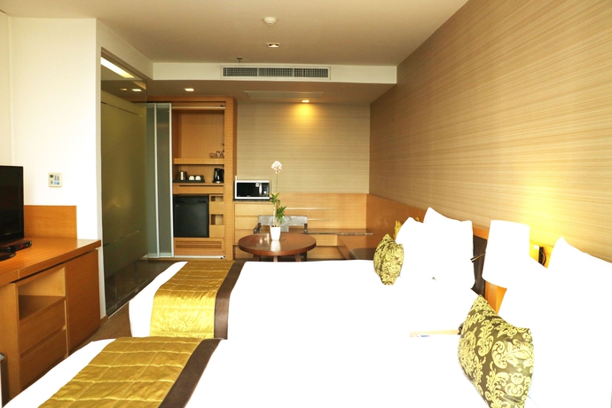 Imagen de la habitación del Hotel Oaks Bangkok Sathorn. Foto 1