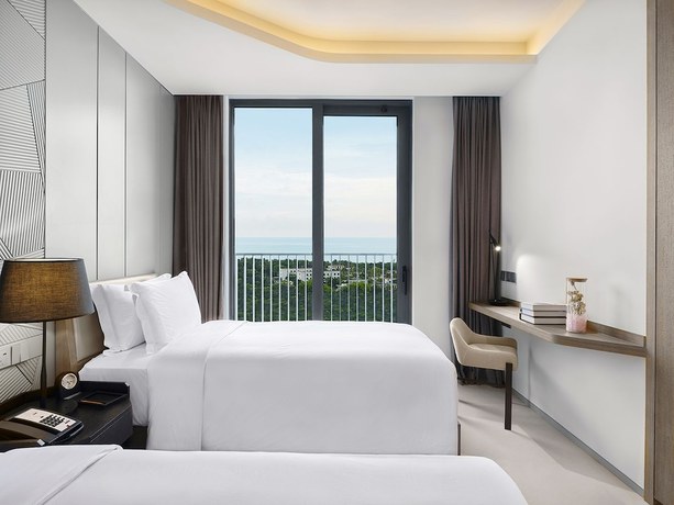 Imagen de la habitación del Hotel Oakwood Apartments Sanya. Foto 2