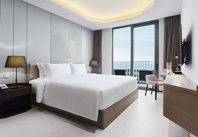 Imagen de la habitación del Hotel Oakwood Apartments Sanya. Foto 10