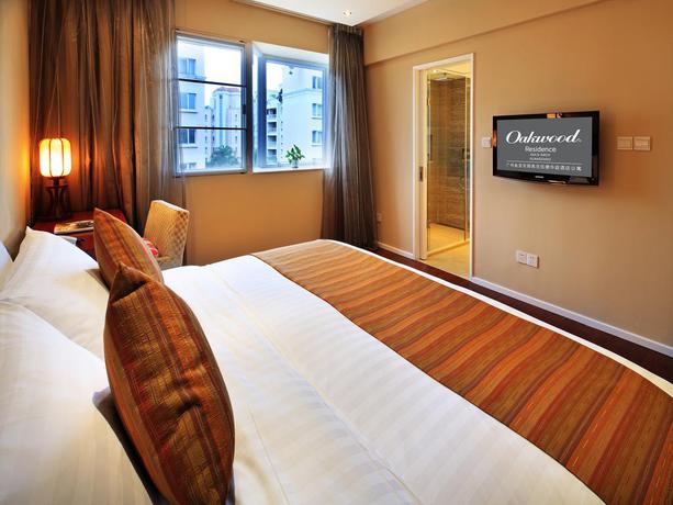 Imagen de la habitación del Hotel Oakwood Gold Arch Residence Guangzhou. Foto 9