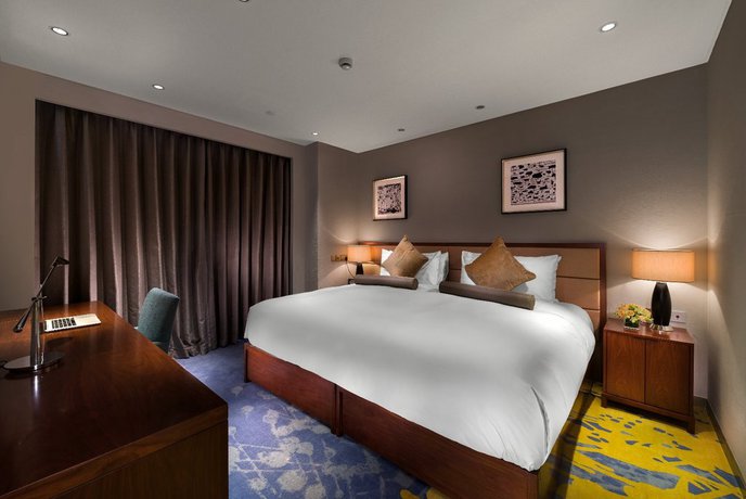 Imagen de la habitación del Hotel Oakwood HotelandResidence Suzhou. Foto 12