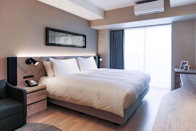 Imagen de la habitación del Hotel Oakwood Suites Yokohama. Foto 3