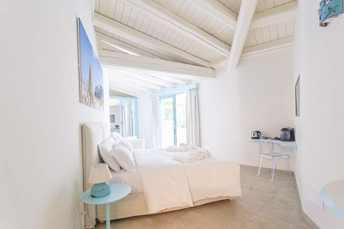 Imagen de la habitación del Hotel Oasi Blu Sardinia. Foto 8