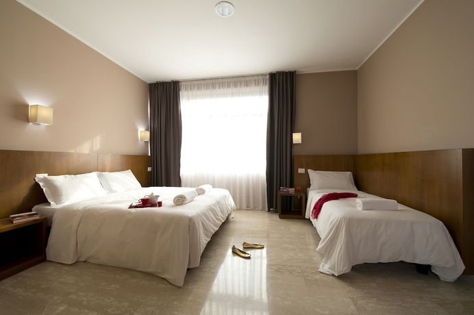 Imagen de la habitación del Hotel Oasi Village. Foto 12