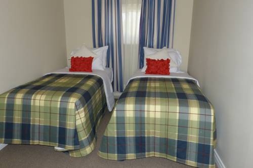 Imagen de la habitación del Hotel Oasis By The Bay Vacation Resort. Foto 12