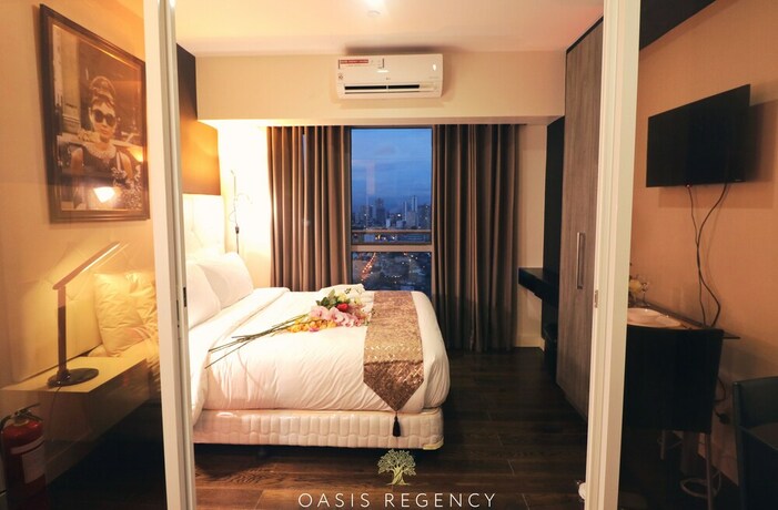 Imagen de la habitación del Hotel Oasis Regency at Acqua Livingstone near Rockwell. Foto 31