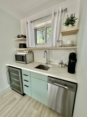 Imagen de la habitación del Hotel Oasis by the Bay Vacation Suites. Foto 14
