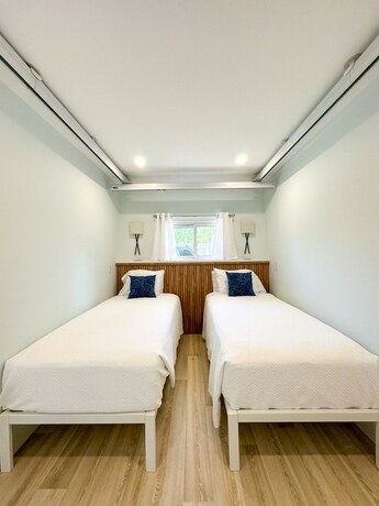 Imagen de la habitación del Hotel Oasis by the Bay Vacation Suites. Foto 17