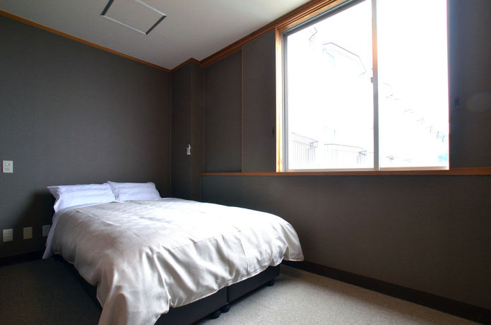 Imagen de la habitación del Hotel Obama-onsen Hamakan. Foto 11