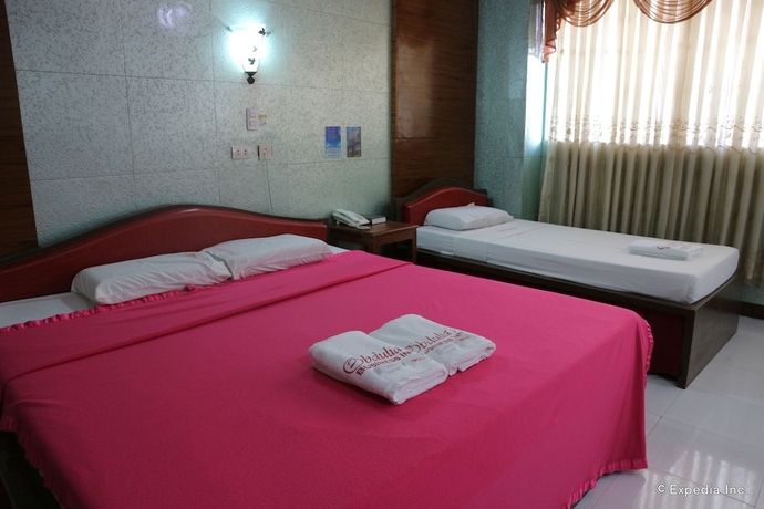 Imagen de la habitación del Hotel Obdulia's Business Inn. Foto 2