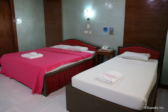 Imagen de la habitación del Hotel Obdulia's Business Inn. Foto 3