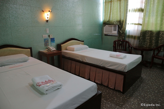 Imagen de la habitación del Hotel Obdulia's Business Inn. Foto 4