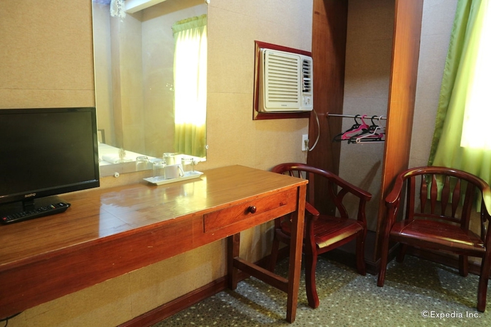 Imagen de la habitación del Hotel Obdulia's Business Inn. Foto 5