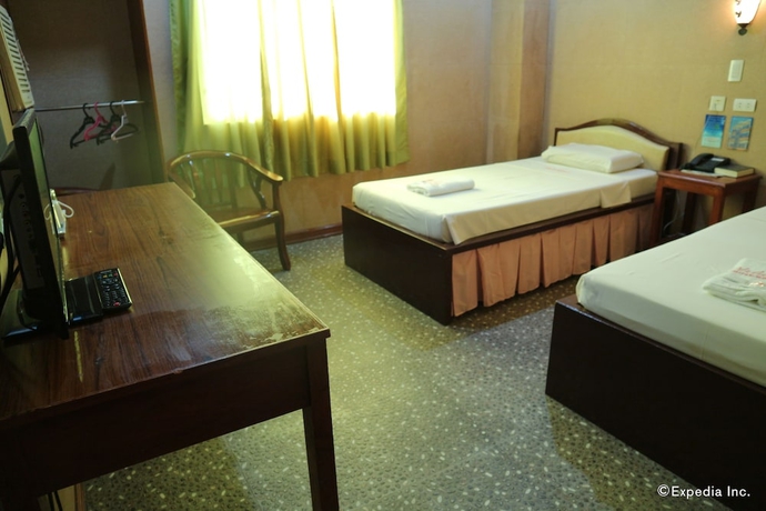 Imagen de la habitación del Hotel Obdulia's Business Inn. Foto 6
