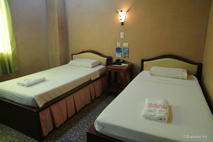 Imagen de la habitación del Hotel Obdulia's Business Inn. Foto 7