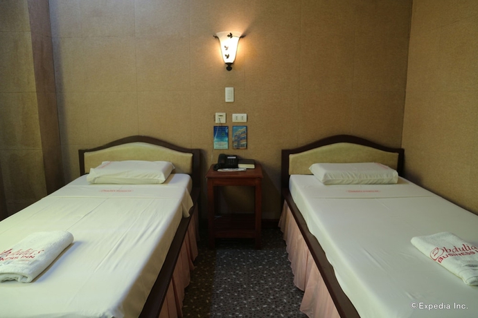 Imagen de la habitación del Hotel Obdulia's Business Inn. Foto 8