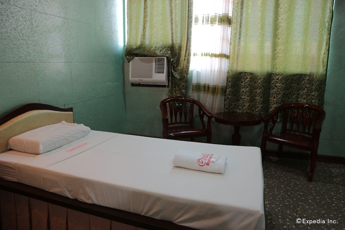 Imagen de la habitación del Hotel Obdulia's Business Inn. Foto 10