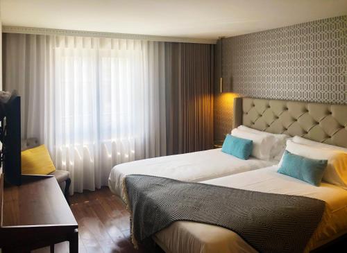 Imagen de la habitación del Hotel Oca Oriental Porto. Foto 18